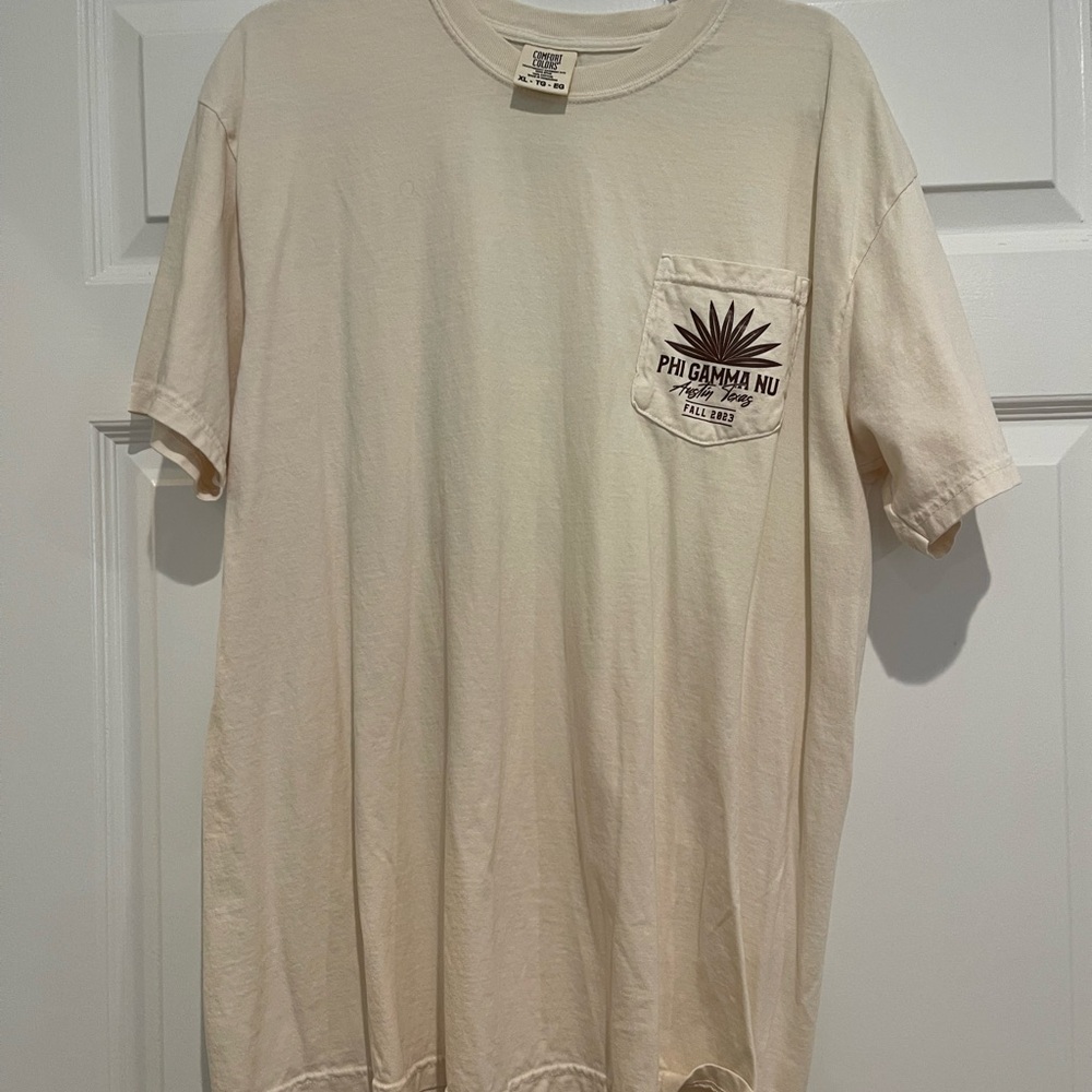 Phi Gamma Nu tshirt pocketwith second shirt for free. Cream is XL. Free one is L